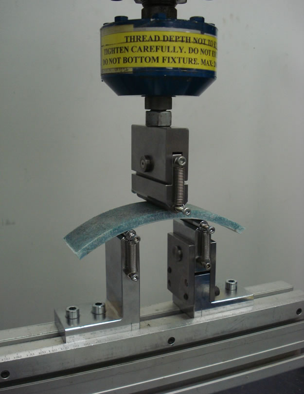 ISO 11296 flexural property test fixture setup.